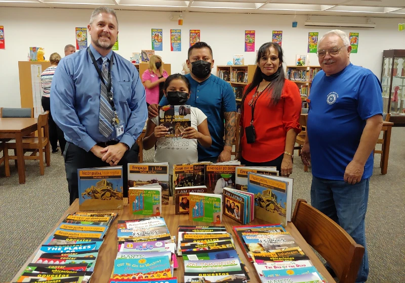 Youth from Nocatee, FL receiving a donation of books from Arcadia Rotary